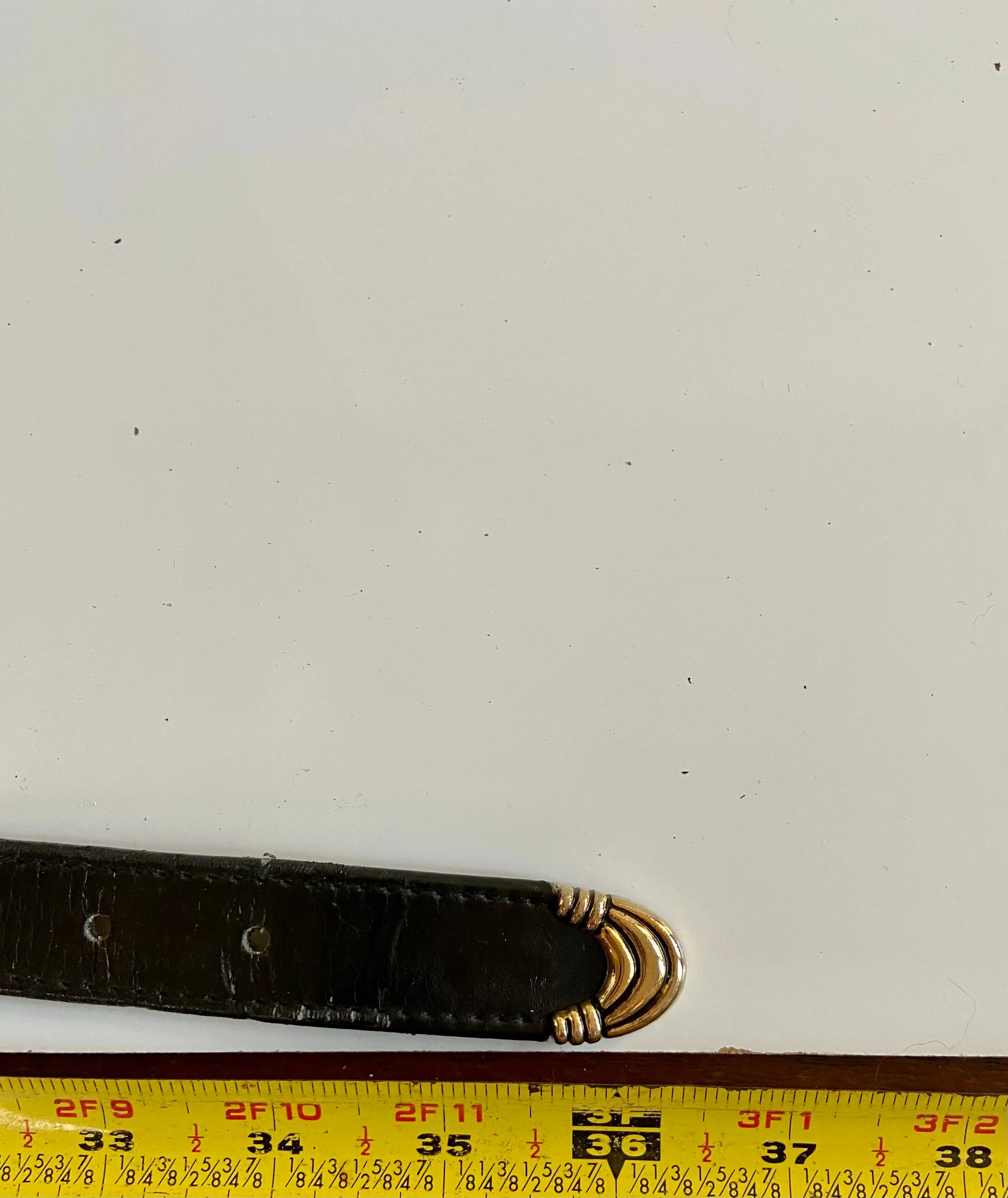 Black and gold leather belt